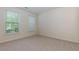 Bedroom featuring neutral carpet, two windows, and a blank canvas for your personal touch at 808 Plaintain Dr, Woodstock, GA 30188