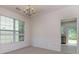 Formal dining room featuring wainscoting detail and views of backyard at 808 Plaintain Dr, Woodstock, GA 30188