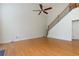 Bright living room with hardwood floors, a staircase, and lots of natural light at 808 Plaintain Dr, Woodstock, GA 30188
