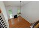 Bright living room with hardwood floors, a fireplace, high ceilings, and lots of natural light at 808 Plaintain Dr, Woodstock, GA 30188