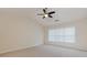 Spacious main bedroom with high ceilings, neutral carpeting, and large window at 808 Plaintain Dr, Woodstock, GA 30188