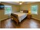 Inviting bedroom featuring hardwood floors, large windows, and a ceiling fan, great spot for relaxation and rest at 861 Marion Se Ave, Atlanta, GA 30312