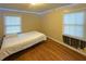 Simple bedroom featuring hardwood floors and natural light, offering a peaceful retreat for rest and relaxation at 861 Marion Se Ave, Atlanta, GA 30312