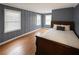 Comfortable bedroom with a bed, hardwood floors, and large windows, perfect for relaxation and rest at 861 Marion Se Ave, Atlanta, GA 30312