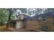 Two-story home featuring a brick facade and a screened-in porch for outdoor enjoyment at 2035 Northland Dr, Lawrenceville, GA 30044
