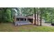 View of the home's side, showcasing the brick details and covered porch at 2035 Northland Dr, Lawrenceville, GA 30044