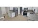 Updated kitchen with stainless appliances, granite countertops, and tile flooring at 2035 Northland Dr, Lawrenceville, GA 30044