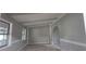 Bright living room featuring large windows, neutral paint, and decorative trim at 2035 Northland Dr, Lawrenceville, GA 30044