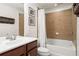 Well-lit bathroom with neutral tile, a shower-tub combination, and a spacious vanity area at 2343 Limehurst Ne Dr, Atlanta, GA 30319