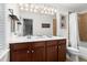 Bathroom with double sink vanity, large mirror, and a shower-tub combination at 2343 Limehurst Ne Dr, Atlanta, GA 30319
