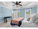 Light blue bedroom features a beautiful tray ceiling and two large windows at 2343 Limehurst Ne Dr, Atlanta, GA 30319