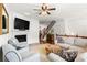 Spacious living room with fireplace, hardwood floors, and comfortable seating area at 2343 Limehurst Ne Dr, Atlanta, GA 30319
