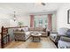 Comfortable living room with neutral colors, hardwood floors, and plenty of natural light at 2343 Limehurst Ne Dr, Atlanta, GA 30319