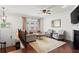 Bright living room featuring hardwood floors, fireplace, and stylish furnishings at 2343 Limehurst Ne Dr, Atlanta, GA 30319