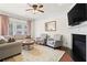 Cozy living room featuring hardwood floors, fireplace, and elegant furnishings at 2343 Limehurst Ne Dr, Atlanta, GA 30319