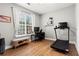 Home office with a hardwood floor, lots of natural light, and modern exercise equipment at 2343 Limehurst Ne Dr, Atlanta, GA 30319
