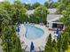 Community pool surrounded by chairs and trees at 2343 Limehurst Ne Dr, Atlanta, GA 30319