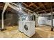 Basement with concrete floors featuring a new washer and dryer at 3211 Hollydale Drive Sw, Atlanta, GA 30311