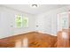 Bright bedroom with hardwood floors, closet and view from the window at 3211 Hollydale Drive Sw, Atlanta, GA 30311