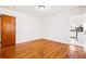 Bedroom with hardwood floors, neutral walls, and a closet at 3211 Hollydale Drive Sw, Atlanta, GA 30311