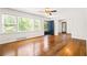 Bright living room featuring large windows, hardwood floors, and a neutral color palette at 3211 Hollydale Drive Sw, Atlanta, GA 30311