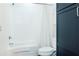 Bright bathroom showcasing a shower-tub combination, white tile, and a modern toilet at 620 Glen Iris Dr # 223, Atlanta, GA 30308