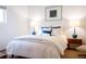 Bright bedroom with large bed, stylish lamps, and neutral tones for a relaxing atmosphere at 620 Glen Iris Dr # 223, Atlanta, GA 30308