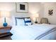 Comfortable bedroom features a soft bed with stylish pillows and warm lighting from table lamps at 620 Glen Iris Dr # 223, Atlanta, GA 30308