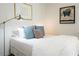 Inviting bedroom featuring plush pillows, reading lamp, and stylish decor for a relaxing and comfortable space at 620 Glen Iris Dr # 223, Atlanta, GA 30308