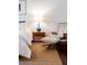 Bedroom with a modern lounge chair and ottoman to a side table with a modern lamp at 620 Glen Iris Dr # 223, Atlanta, GA 30308