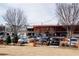 Cityscape view of the retail area with stores, parking, and a grassy area at 620 Glen Iris Dr # 223, Atlanta, GA 30308