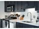 Close up of the kitchen featuring stainless steel appliances and bright countertops at 620 Glen Iris Dr # 223, Atlanta, GA 30308