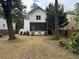 Home exterior featuring a backyard with a mix of grassy areas, landscaping, and a privacy fence at 2552 White Oak Dr, Decatur, GA 30032