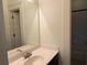 Bathroom featuring tile flooring, quartz countertops, and a large mirror, and separate toilet room at 2552 White Oak Dr, Decatur, GA 30032