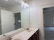 Spacious bathroom featuring double sinks, a large mirror, and neutral color palette at 2552 White Oak Dr, Decatur, GA 30032