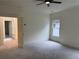 Bedroom featuring neutral walls, carpeted flooring, and natural light from a window at 2552 White Oak Dr, Decatur, GA 30032