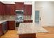 This kitchen showcases stainless appliances, granite countertops, and outside access at 2552 White Oak Dr, Decatur, GA 30032