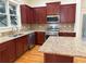 Well-equipped kitchen features granite countertops, stainless appliances, and ample cabinetry at 2552 White Oak Dr, Decatur, GA 30032