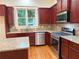 Charming kitchen featuring stainless steel appliances, granite countertops, and ample cabinetry at 2552 White Oak Dr, Decatur, GA 30032
