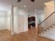Open-concept living space with hardwood floors flowing to the kitchen area at 2552 White Oak Dr, Decatur, GA 30032