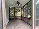 View from a screened-in porch with dark wood flooring and a black ceiling fan at 2552 White Oak Dr, Decatur, GA 30032