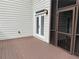 View of screened-in porch with wood flooring and glass paneled doors to the home's interior at 2552 White Oak Dr, Decatur, GA 30032