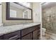 Modern bathroom featuring a spacious vanity with stone countertop and a tiled walk-in shower at 3280 Pebble Hill Dr, Marietta, GA 30062