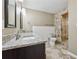 Modern bathroom featuring dual sinks with granite counters and a tiled walk-in shower at 3280 Pebble Hill Dr, Marietta, GA 30062