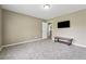 Spacious bedroom with neutral walls, plush carpet, and a mounted TV for relaxation at 3280 Pebble Hill Dr, Marietta, GA 30062