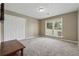 Neutral bedroom with a large window, closet, and plush carpeting, ideal for comfort at 3280 Pebble Hill Dr, Marietta, GA 30062