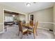 Comfortable dining room features a round table and chairs, connecting seamlessly to the living room at 3280 Pebble Hill Dr, Marietta, GA 30062