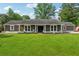 Charming single-story home with a well-manicured lawn and welcoming front porch at 3280 Pebble Hill Dr, Marietta, GA 30062