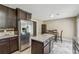 Spacious kitchen with granite countertops, stainless steel refrigerator, and dark wood cabinetry at 3280 Pebble Hill Dr, Marietta, GA 30062