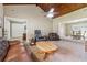 Spacious living room with vaulted ceilings, comfortable seating and seamless transition to the dining area at 3280 Pebble Hill Dr, Marietta, GA 30062